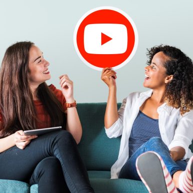 Women holding a YouTube icon